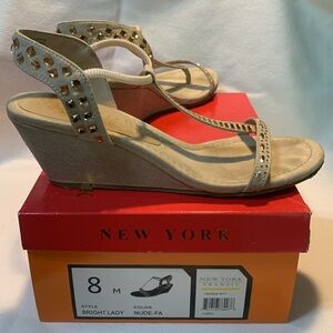 2 1/4 inch heels. Size 8M. Nude wedge with bling to add touch of fun. NY Transit